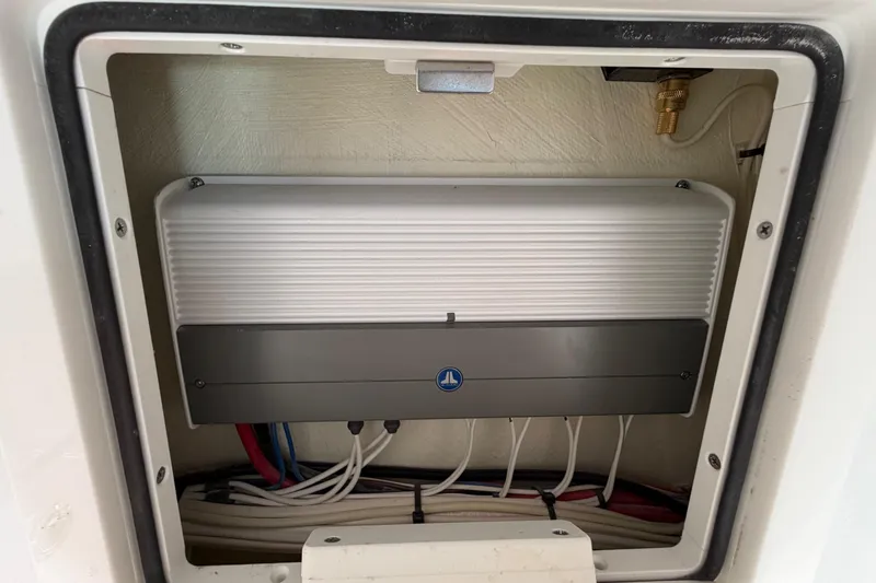 Slide: The Image of Electrical panel inside 2023 Costa Custom Boats 264 HC, featuring organized wiring and components. - 57