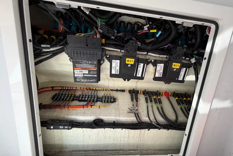 Slide: The Image of Electrical wiring and components inside a 2023 Costa Custom Boats 264 HC. - 59