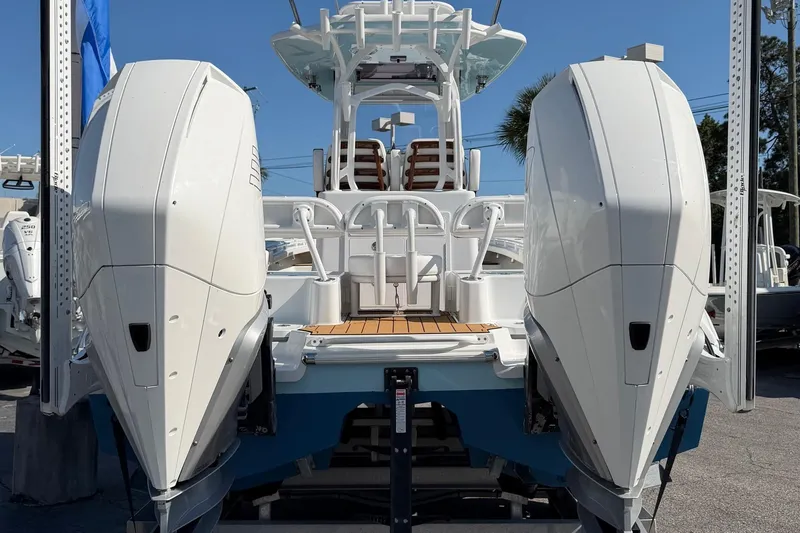 Slide: The Image of 2023 Costa Custom Boats 264 HC with dual outboard engines, rear view. - 6