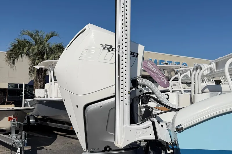 Slide: The Image of 2023 Costa Custom Boats 264 HC with powerful outboard motor, displayed outdoors. - 64