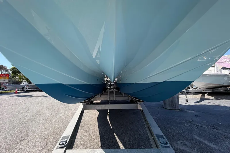 Slide: The Image of 2023 Costa Custom Boats 264 HC hull on trailer, showcasing sleek design and craftsmanship. - 66