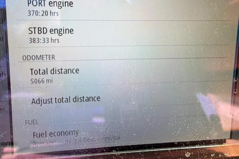 Slide: The Image of Display screen of 2023 Costa Custom Boats 264 HC showing engine hours and total distance. - 69