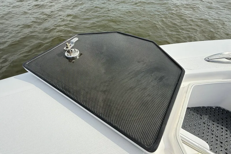 Slide: The Image of 2018 SeaHunter 35 Tournament boat hatch with carbon fiber finish on open water. - 100