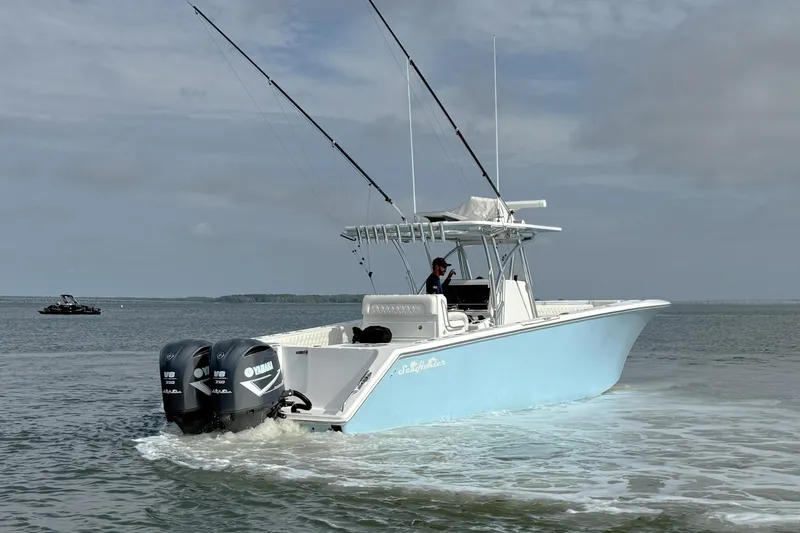 Slide: The Image of 2018 SeaHunter 35 Tournament boat with dual Yamaha engines on open water. - 11