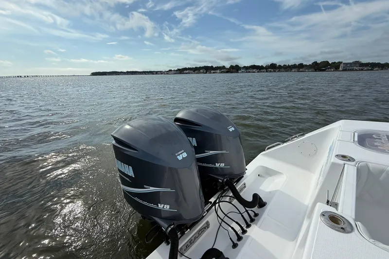 Slide: The Image of 2018 SeaHunter 35 Tournament boat with twin Yamaha V8 engines on open water. - 12