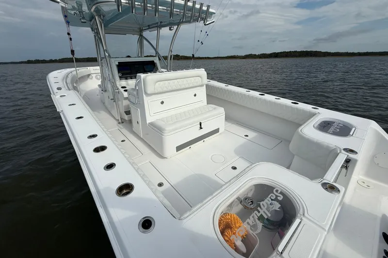 Slide: The Image of 2018 SeaHunter 35 Tournament boat with spacious deck and seating on calm water. - 14