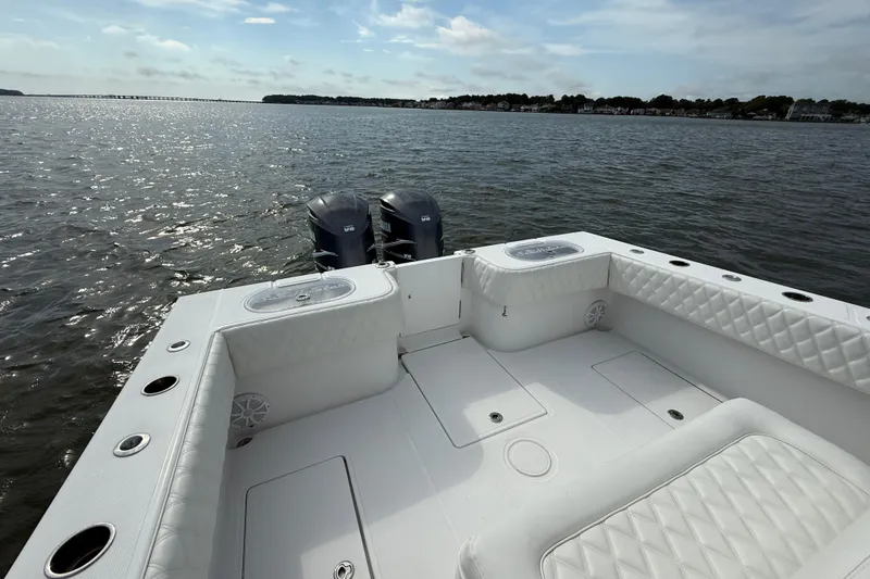 Slide: The Image of 2018 SeaHunter 35 Tournament boat with dual engines on calm water. - 15