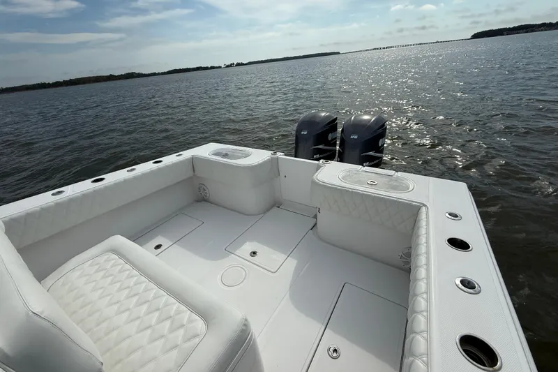 Slide: The Image of 2018 SeaHunter 35 Tournament boat with dual engines on open water. - 16
