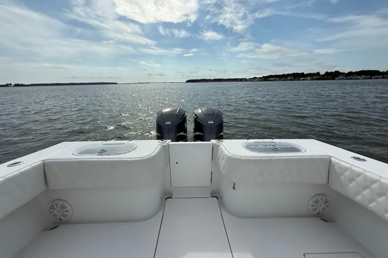 Slide: The Image of 2018 SeaHunter 35 Tournament boat with dual engines on a calm sea. - 18