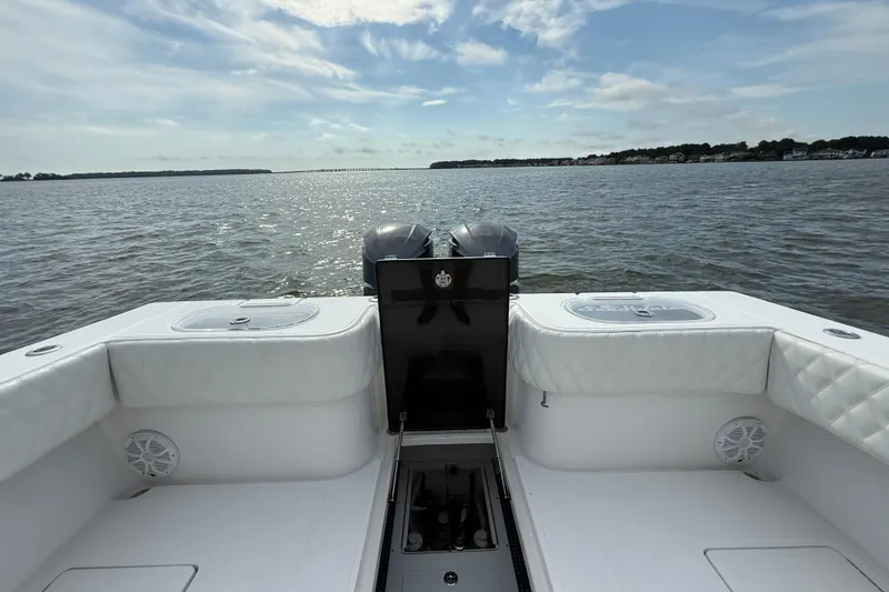 Slide: The Image of 2018 SeaHunter 35 Tournament boat on calm waters under a partly cloudy sky. - 19