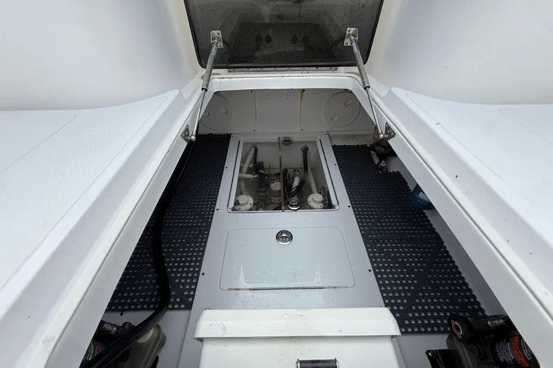 Slide: The Image of 2018 SeaHunter 35 Tournament boat interior with open hatch and visible mechanical components. - 20