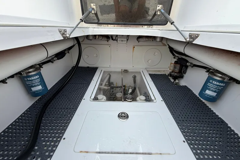 Slide: The Image of 2018 SeaHunter 35 Tournament boat interior with Yamaha fuel filters and storage compartments. - 21