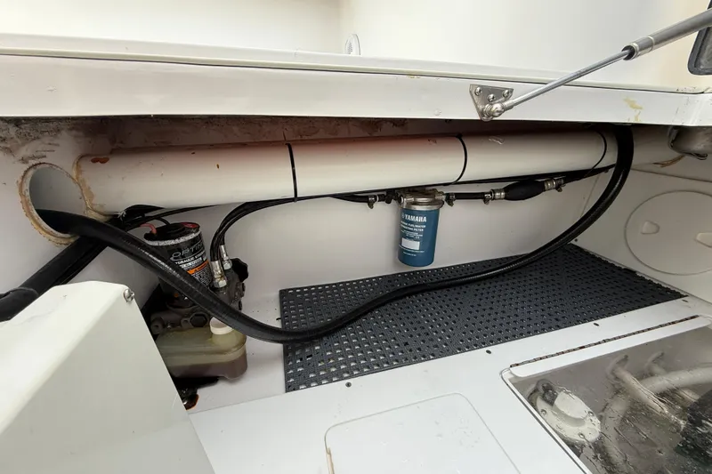 Slide: The Image of 2018 SeaHunter 35 Tournament boat engine compartment with Yamaha fuel filter and hoses. - 22