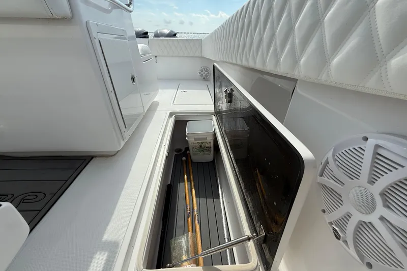 Slide: The Image of 2018 SeaHunter 35 Tournament boat interior with storage compartment and marine speaker. - 31