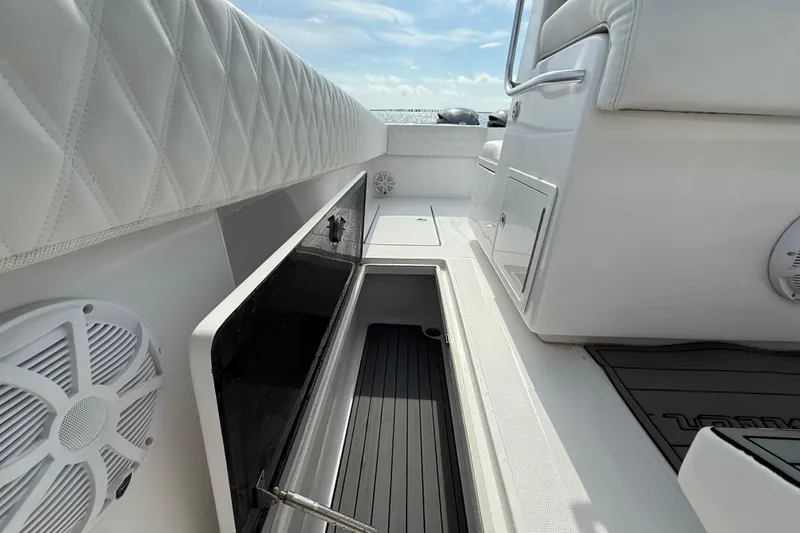 Slide: The Image of 2018 SeaHunter 35 Tournament boat interior with storage compartment and seating. - 35