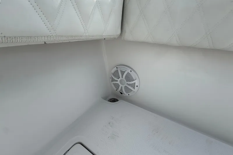 Slide: The Image of 2018 SeaHunter 35 Tournament boat interior with speaker and cushioned seating. - 36