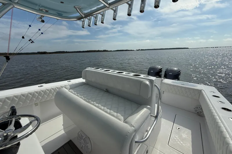 Slide: The Image of 2018 SeaHunter 35 Tournament boat interior with dual engines on a sunny day. - 41