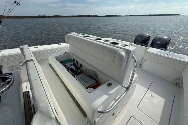 Slide: The Image of 2018 SeaHunter 35 Tournament boat with open storage, dual engines, and scenic water view. - 42