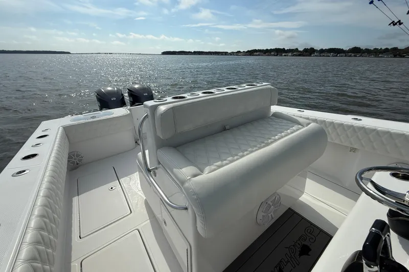 Slide: The Image of 2018 SeaHunter 35 Tournament boat with dual engines on a calm sea. - 43