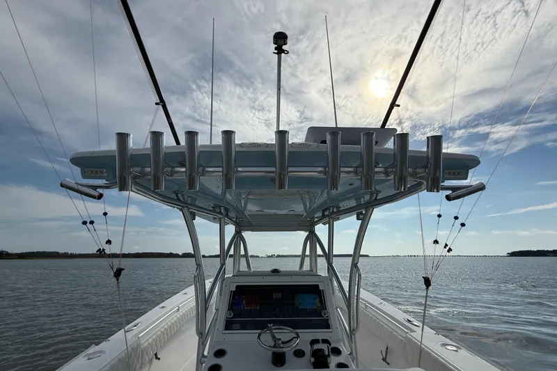 Slide: The Image of 2018 SeaHunter 35 Tournament boat on calm water under a partly cloudy sky. - 49