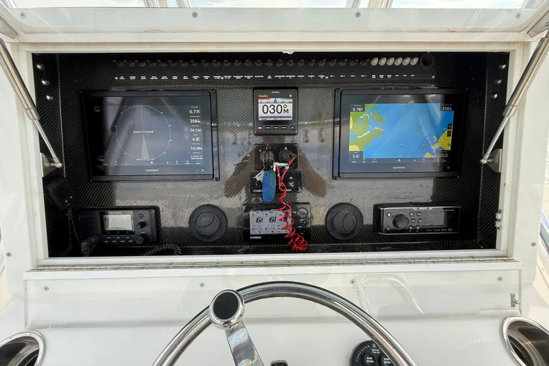 Slide: The Image of Dashboard of 2018 SeaHunter 35 Tournament boat with navigation and control systems. - 55