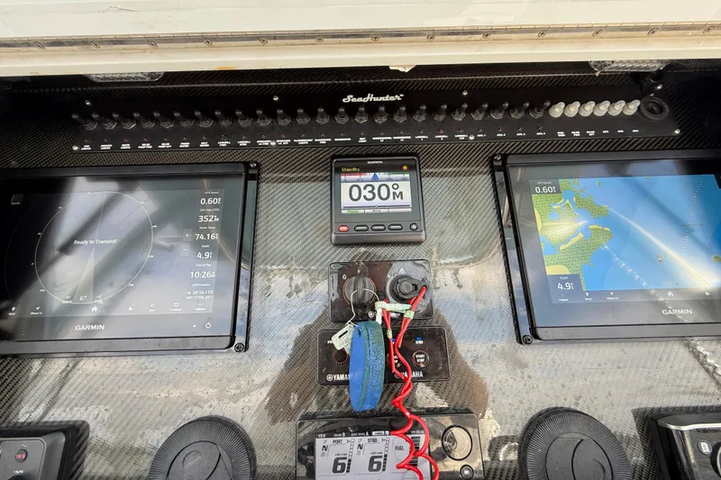 Slide: The Image of Dashboard of 2018 SeaHunter 35 Tournament boat with Garmin navigation displays. - 58