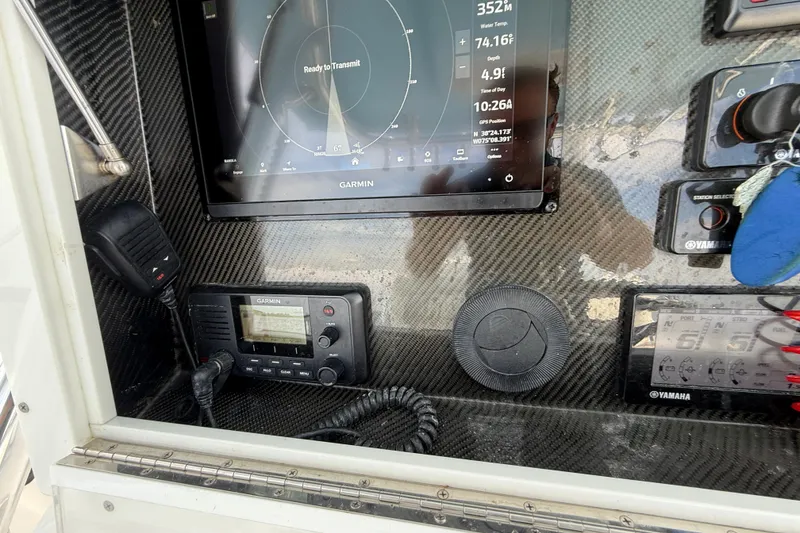 Slide: The Image of Control panel of 2018 SeaHunter 35 Tournament boat with Garmin navigation system. - 59