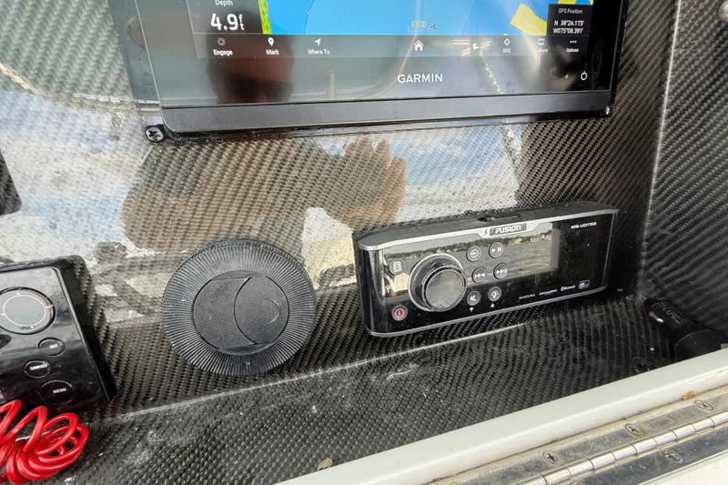 Slide: The Image of Carbon fiber dashboard of 2018 SeaHunter 35 Tournament with Garmin and Fusion electronics. - 61