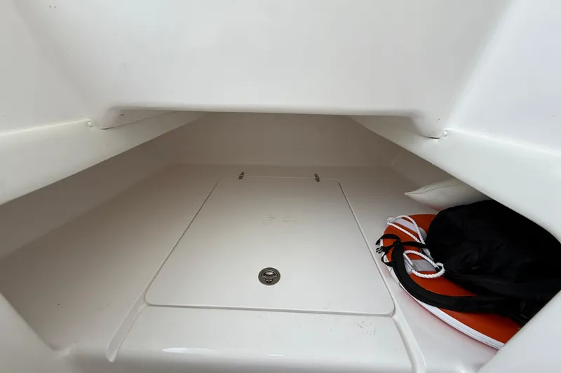 Slide: The Image of 2018 SeaHunter 35 Tournament storage compartment with life jacket and bag. - 69