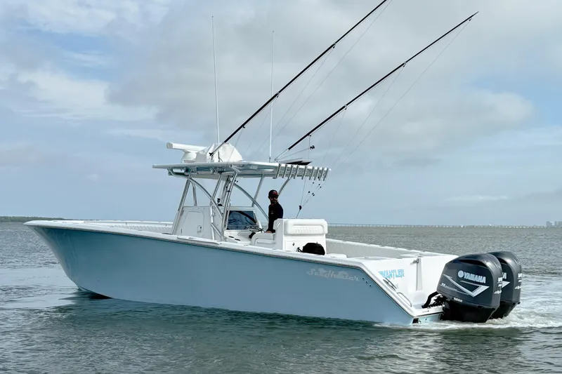 Slide: The Image of 2018 SeaHunter 35 Tournament boat with dual Yamaha engines on open water. - 7