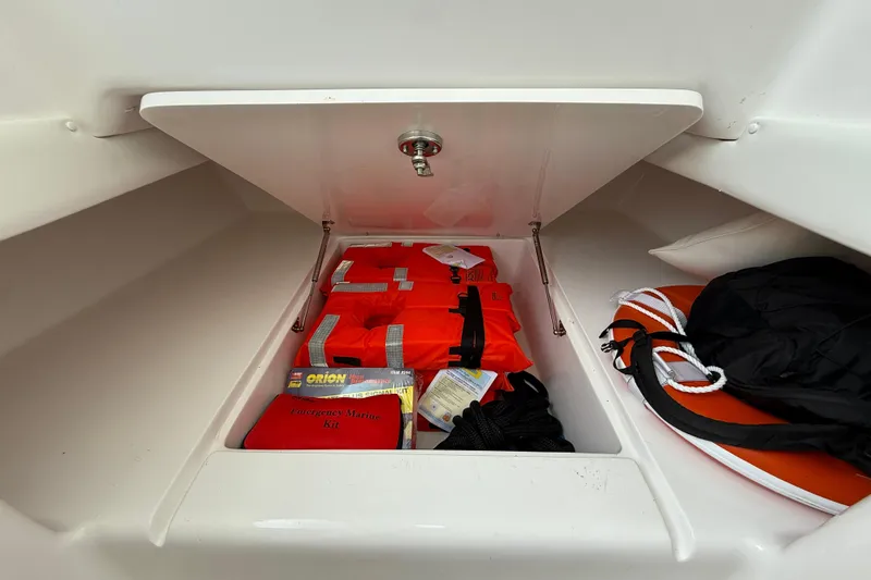 Slide: The Image of Storage compartment in 2018 SeaHunter 35 Tournament with life jackets and emergency marine kit. - 70