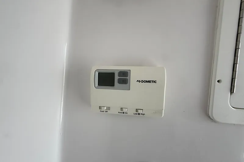 Slide: The Image of Dometic control panel on 2018 SeaHunter 35 Tournament boat interior wall. - 71