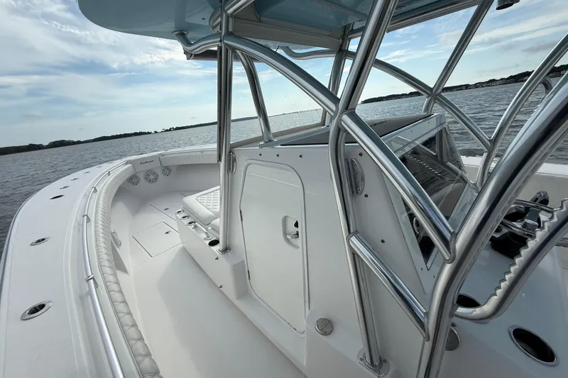 Slide: The Image of 2018 SeaHunter 35 Tournament boat on calm waters, showcasing sleek design and spacious deck. - 72