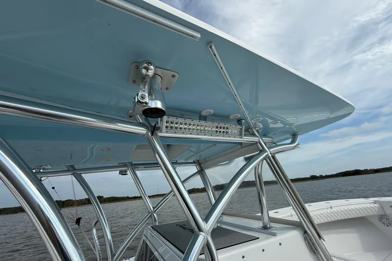 Slide: The Image of 2018 SeaHunter 35 Tournament boat with sleek T-top and sturdy metal framework. - 75