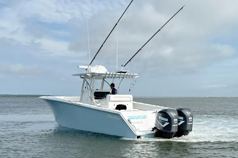 Slide: The Image of 2018 SeaHunter 35 Tournament boat with dual Yamaha engines on open water. - 8