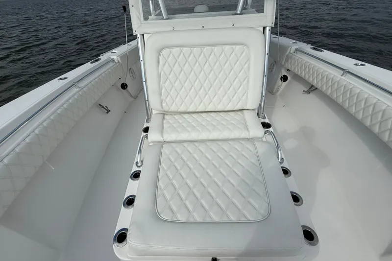 Slide: The Image of 2018 SeaHunter 35 Tournament boat with white quilted seating on open water. - 80
