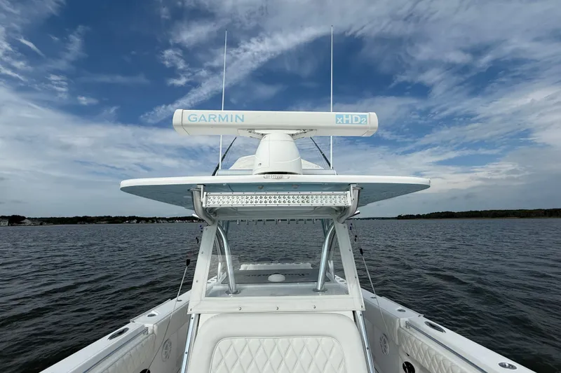 Slide: The Image of 2018 SeaHunter 35 Tournament boat with Garmin xHD2 radar on open water under blue sky. - 82