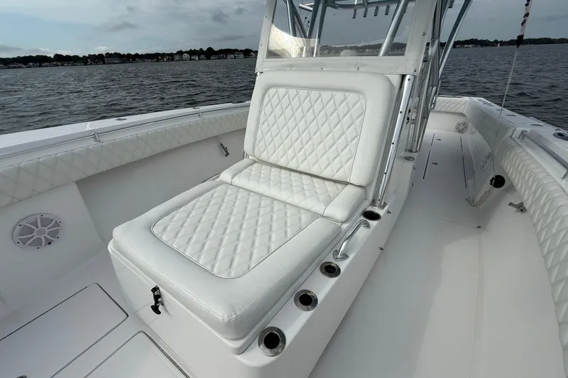 Slide: The Image of 2018 SeaHunter 35 Tournament boat with white quilted seating on open water. - 83