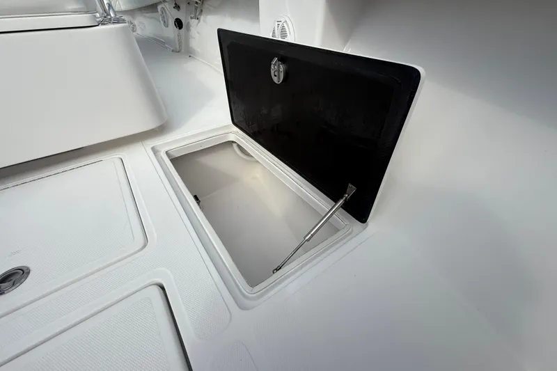 Slide: The Image of Open storage compartment on 2018 SeaHunter 35 Tournament boat deck. - 86