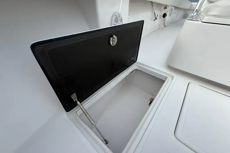 Slide: The Image of Open storage compartment on 2018 SeaHunter 35 Tournament boat deck. - 88
