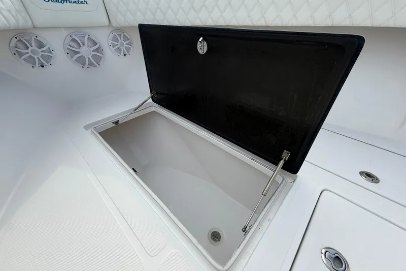 Slide: The Image of Open storage compartment on 2018 SeaHunter 35 Tournament boat deck. - 89