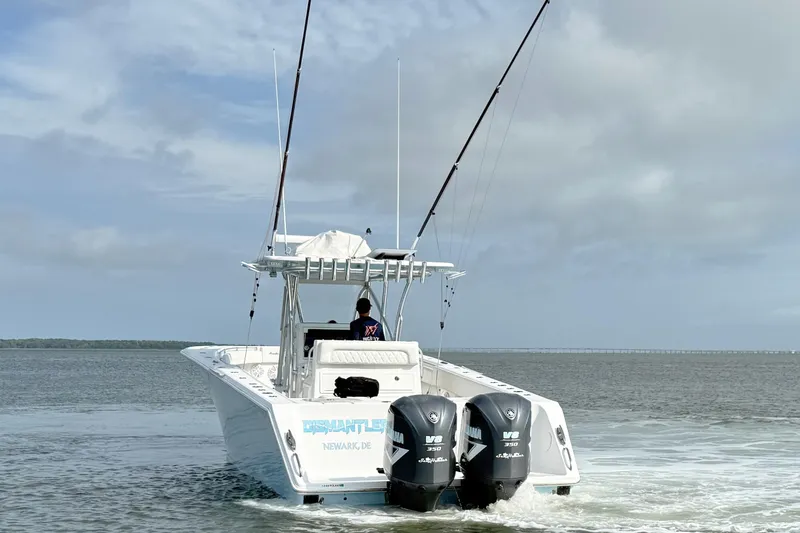 Slide: The Image of 2018 SeaHunter 35 Tournament boat with dual Yamaha engines on open water. - 9