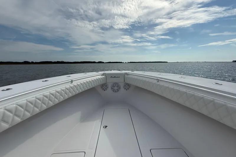 Slide: The Image of 2018 SeaHunter 35 Tournament boat on calm waters under a partly cloudy sky. - 94