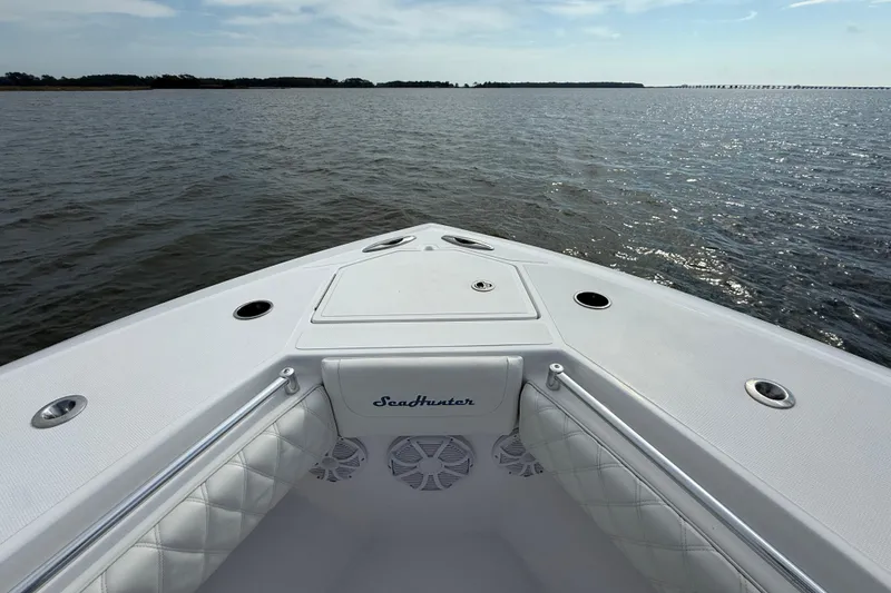 Slide: The Image of Bow of 2018 SeaHunter 35 Tournament boat on open water, clear sky. - 97