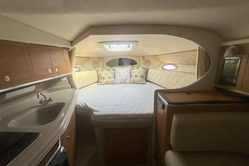 Slide: The Image of Interior of 2006 Sea Ray 290 Amberjack boat with cozy cabin and kitchenette. - 30