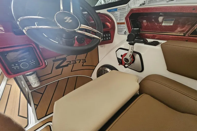 Slide: The Image of Interior of 2025 Varatti Z2373 boat with steering wheel and control panel. - 14