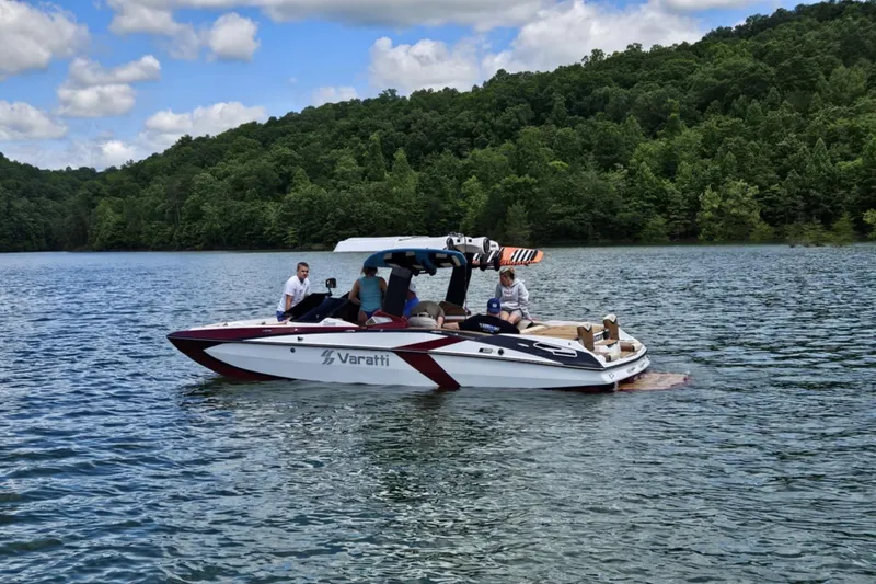 Slide: The Image of 2025 Varatti Z2373 boat on a lake with people, surrounded by lush greenery. - 21