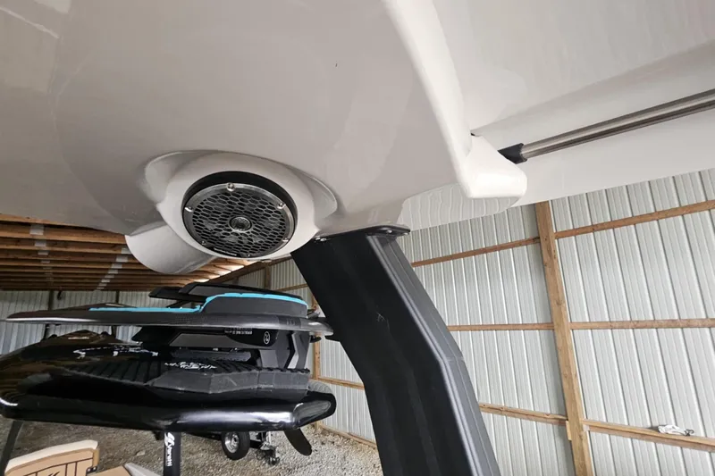 Slide: The Image of 2025 Varatti Z2373 boat with speaker and wakeboard rack in storage shed. - 23