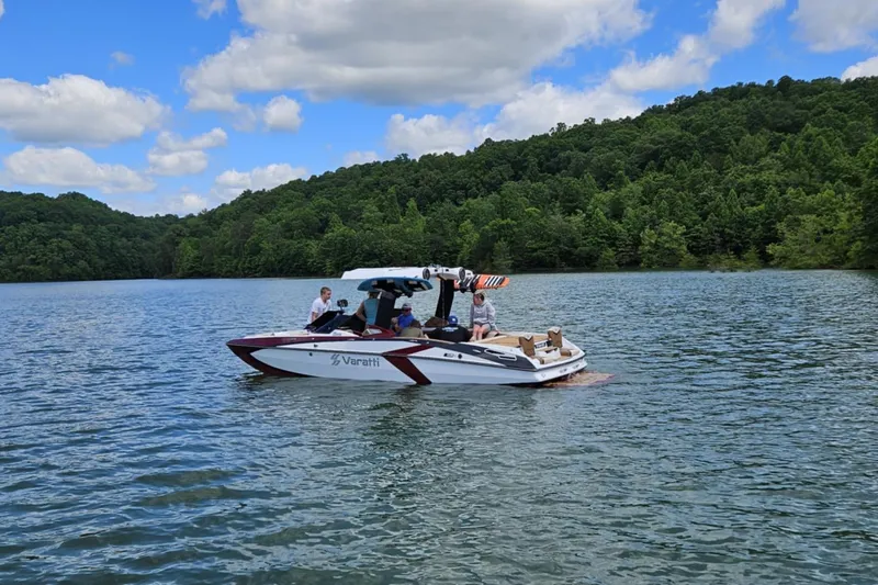 Slide: The Image of 2025 Varatti Z2373 boat on a scenic lake with lush green hills. - 3