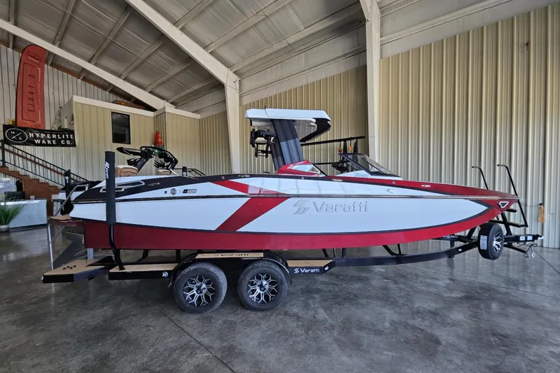 Slide: The Image of 2025 Varatti Z2373 boat on trailer in indoor showroom setting. - 9